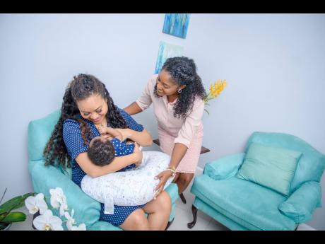 Certified Breastfeeding Specialist Ruth-Ann Taylor (right) checks in on patient Xinyu Addae-Lee. Certified Breastfeeding Specialist Ruth-Ann Taylor (right) checks in on patient Xinyu Addae-Lee. Certified Breastfeeding Specialist Ruth-Ann Taylor (right) che
