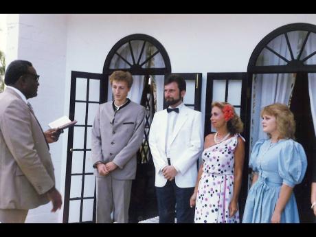 The Rev Conrad Pitkin officiates at the wedding of Alfred Vlaschitz (centre) and wife Renate, alongside two witnesses, at their wedding ceremony 35 years ago at Half Moon in Montego Bay.