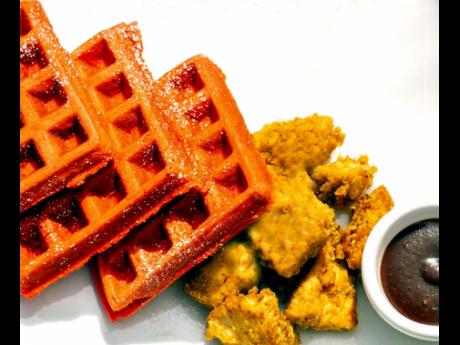 Red velvet waffles served with chicken is a meal that both adults and children will feel satisfied with eating at any time of the day.