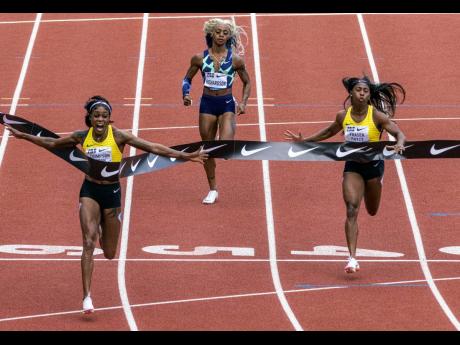 Jamaica’s Elaine Thompson Herah (left) crosses the line ahead of fellow Jamaican Shelly-Ann Fraser-Pryce (right) and American Sha’Carri Richardson at the Prefontaine Classic in Eugene, Oregon on Saturday.