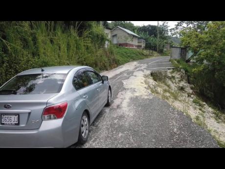 A section of the roadway in Jointwood, St Elizabeth that residents claim is challenging to nagivate, especially at nights due to a massive breakaway that occurred last November.
