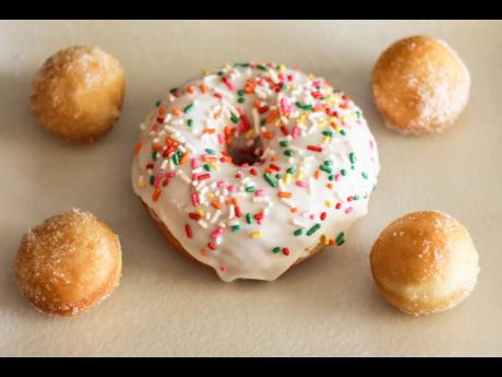 Sugary glazed doughnuts, topped with sprinkles, are absolutely ‘dough-licious’.