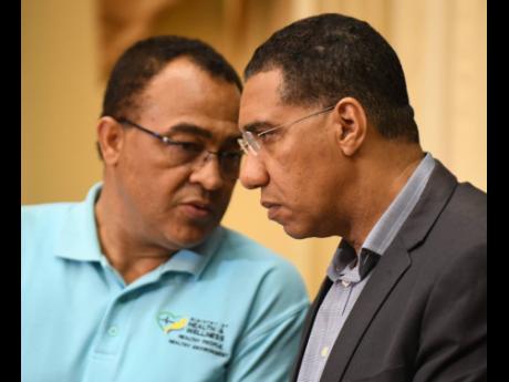 Health and Wellness Minister Dr Christopher Tufton (left) and Prime Minister Andrew Holness have been at the forefront of the COVID-19 battle.