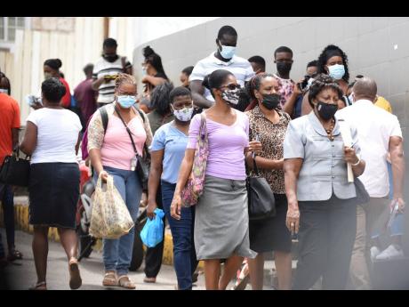 Many persons in the town of Mandeville wore face mask to help stem the spread of COVID-19