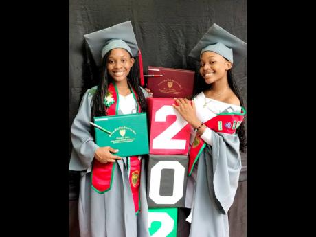Twins Stania (left) and Stanea McIntosh during their graduation ceremony at Montego Bay High School.