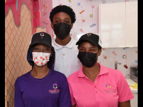 Cheery Staff at Candy Craze in Progressive Mall, Barbican Road, are (from left) Jodene Pusey, Robert Brooks and Petagayle Johnson.