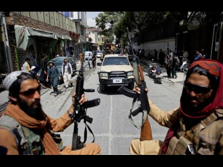 Taliban fighters patrol Kabul, Afghanistan. The Taliban celebrated Afghanistan’s Independence Day by declaring they beat the United States, but challenges to their rule ranging from running a country severely short on cash and bureaucrats to potentially 