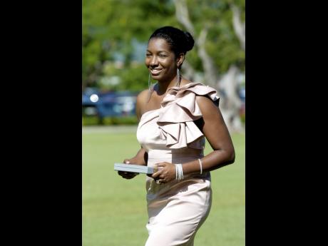 Niambe McIntosh following her father Winston 'Peter Tosh' McIntosh's posthumous investiture into the Order of Merit in 2012. Niambe, who was a little girl when her father passed, recently asked her followers on Instagram to share when they first learnt abo