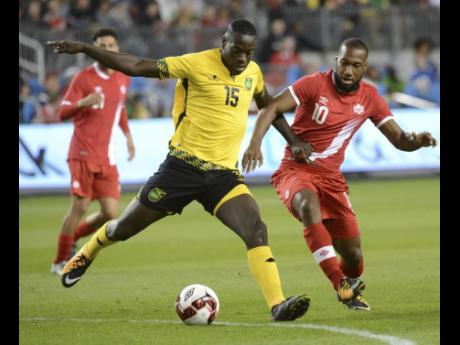 File
Je-Vaughn Watson (left) in action for Jamaica during a friendly match against Canada in September 2017.