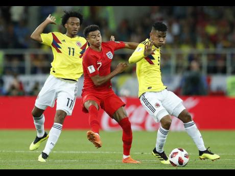 
Colombia’s Juan Cuadrado (left) and teammate Wilmar Barrios, and England’s Jesse Lingard, challenge for the ball during the round of 16 match between Colombia and England at the 2018 FIFA World Cup in the Spartak Stadium, in Moscow, Russia, Tuesday, J