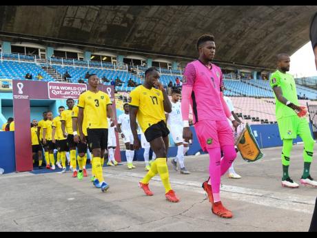 Captain Andre Blake (second right) lead members of Jamaica’s national senior football team onto the National Stadium field ahead of their Concacaf Final Round FIFA World Cup qualifier against Panama on Sunday, September 5, 2021. 