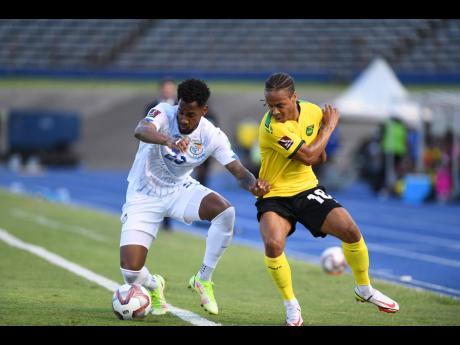 Jamaica’s Bobby Reid (right) losses possession to Panama’s Michael Amir Murillo during the Concacaf Final Round FIFA World Cup qualifier at the National Stadium on Sunday, September 5, 2021. Panama won 3-0.September 5,2021.