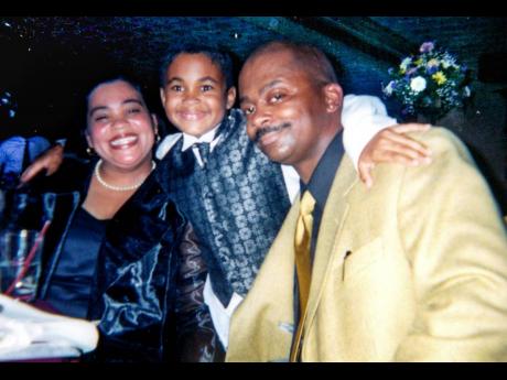 Simone Mitchell, a Jamaican from Mandeville; her late fiance Clinton Davis, who died in the 9/11 attack; and their son Julian 20 years ago.