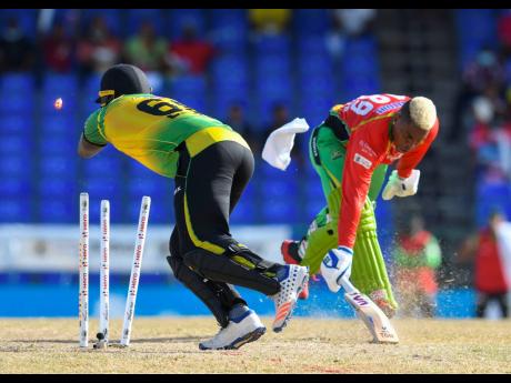 
Shimron Hetmyer (right) of Guyana Amazon Warriors run out by Kennar Lewis (left) of Jamaica Tallawahs during the 2021 Hero Caribbean Premier League match at Warner Park Sporting Complex yesterday in Basseterre, Saint Kitts and Nevis. The Tallawahs lost by