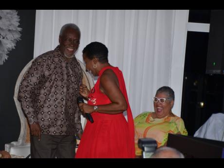 Former Prime Minister P.J. Patterson dances with singer Karen Smith during the launch of his book ‘My Political Journey’, at the S Hotel in Montego Bay.