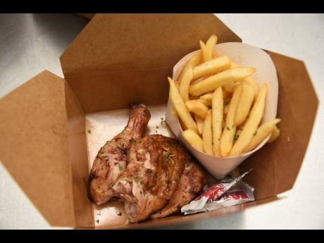 Leg and thigh anyone? The home of jerk showcases its signature jerk chicken quarter and fries.