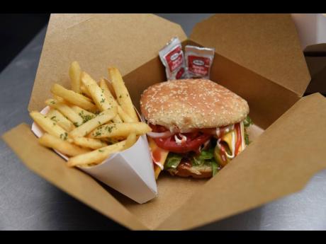 Spice up your taste buds with Jungle Fiah’s chicken sandwich, served with fries.
