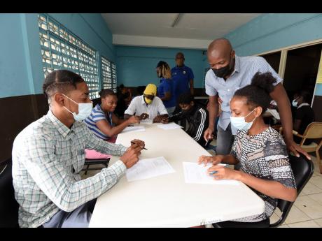 Ian Allen/Photographer 
Courtney Edwards (second right), councillor for the Independence City division in Portmore, St Catherine, interacting with unattached youth during a training session at the Independence City Community Centre on Thursday, September 1