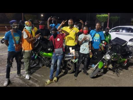 Portmore ENDS bikers pose for a shot after completing their rounds on a no-movement day two weeks ago.
