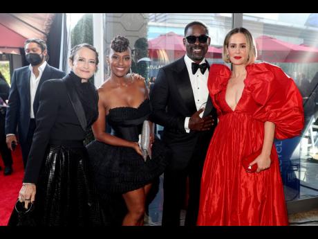 From second left: Ryan Michelle Bathe, Sterling K. Brown, and Sarah Paulson, right, arrive at the Emmy Awards.