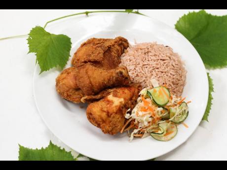 Fried chicken served with rice and peas could almost be Jamaica’s national dish. From lunchtime until dinner hours, every day of the week, Our Place always has this Jamaican staple on the menu.