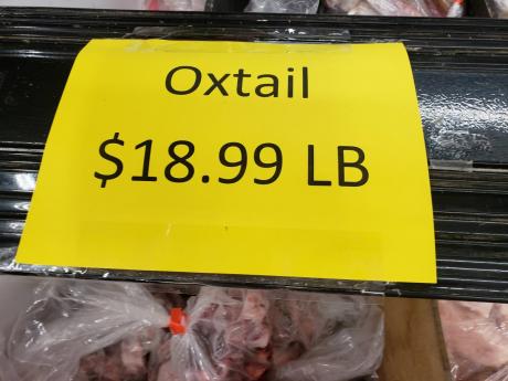 A sign in a Caribbean store on Main Street in East Orange, New Jersey, advertising oxtail for US$18.99 (more than J$2,800 per pound).