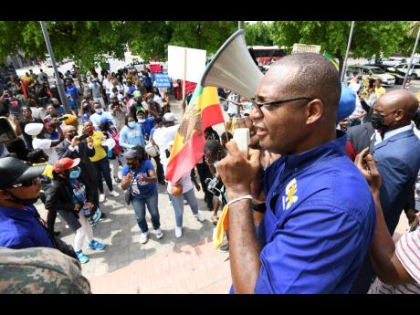 
Joseph Patterson, president of the United Independent Congress (UIC), speaks to protesters who marched from St William Grant Park near Ward Theatre in downtown Kingston on Wednesday, September 22. 