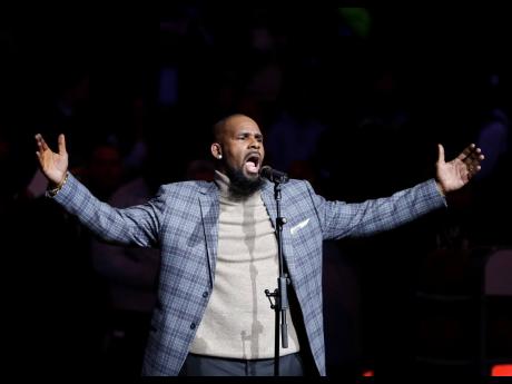 R Kelly performs the national anthem before an NBA basketball game between the Brooklyn Nets and the Atlanta Hawks in New York on December 21, 2007.