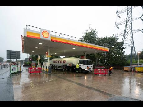 A fuel delivery is made to a petrol station in Manchester, England, which had run out of fuel after an outbreak of panic buying in Britain over the past several days. AP Photo