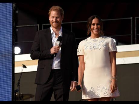 Prince Harry, the Duke of Sussex (left), and Meghan, the Duchess of Sussex, speak at Global Citizen Live in Central Park.