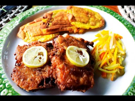 Fried fish and pressed plantain with a side of escovitch sauce for the topping.