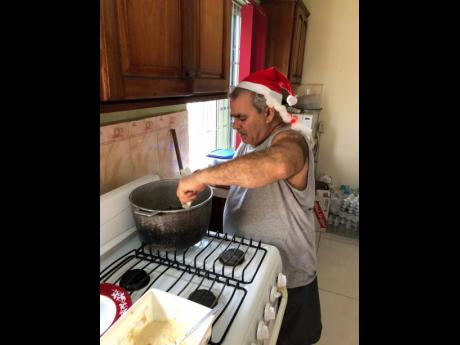 Franco Cagnazzo, the father of Amanda Torrington, assists with the meal preparation for the homeless food drive spearheaded by Amanda and his son-in-law, Chad.