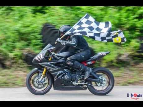 It takes a lot of guts to get a checkered flag on a bike at Dover.