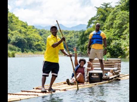 Brother and sister duo Teika and Roberto Samuda of Being Jamaican Tour Company are happily rafted down the Rio Grande by Raft Captain Lawrence Chisolm.