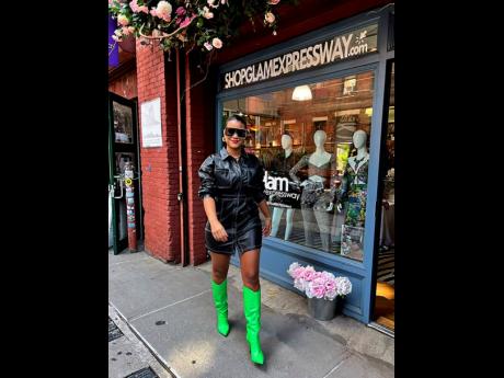 Above: Glam Expressway owner Lindsay Stuart in a vegan leather dress available at her store.