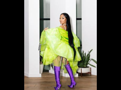Yawdie Babe for sure! Dancehall artiste Shenseea makes a statement in purple thigh highs and a bedazzled body suit. 