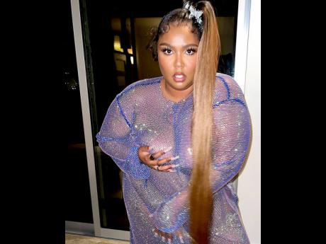 Dressed by Jason Rembert, Lizzo opted for a nearly naked purple gown. 