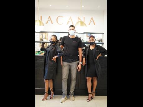 Kwame Hall (centre), managing director, JACANA, and and members of the customer experience team, Samantha Jones (left) and Arika Scarlette. 