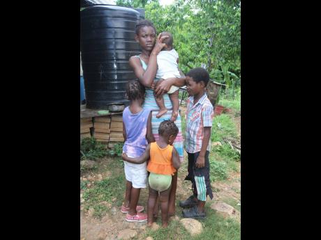Kashara Reid of Mungle Town, New Longville, Clarendon, is frustrated with the lack of support from the fathers of her four children.