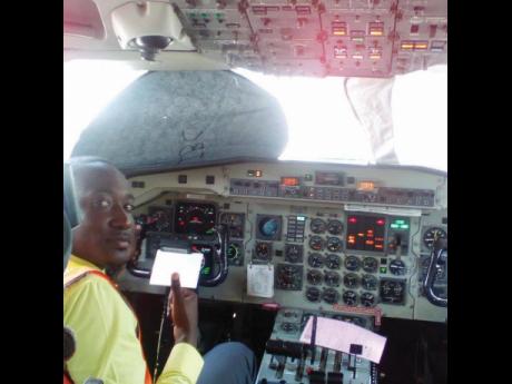 Rohan Ellis sits in the cockpit of the Cessna training aircraft on which he is completing his flight training at the Aeronautical School of the West Indies, located at the Tinson Pen Aerodrome, Kingston. 