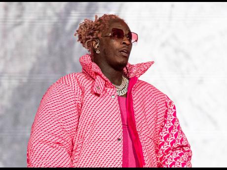 Young Thug says that an apartment concierge let an unknown person take his Louis Vuitton bag holding jewellry, money and about 200 unreleased songs.