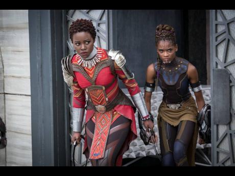  Lupita Nyong’o (left), and Letitia Wright in a scene from Marvel Studios’ ‘Black Panther’.