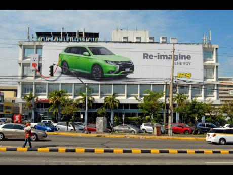 
A banner advertising the JPS Re-Imagine Campaign is seen mounted at the headquarters of Jamaica Public Service Company in 2016. JPS Foundation and IDB Lab are collaborating on a e-mobility/electric vehicle ecosystem project, which includes the launch of a