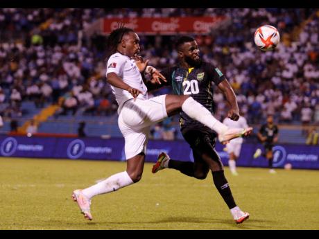 
Jamaica’s Kemar Lawrence (right) battles for the ball with Honduras’ Alberth Elis during a Concacaf World Cup Qualifier at the Metropolitan Olympic Stadium in San Pedro Sula, Honduras, on Wednesday, October 13. Jamaica won 2-0.