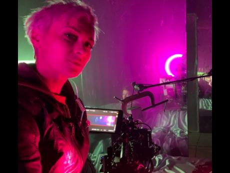 This photo provided by Adam Egypt Mortimer shows cinematographer Halyna Hutchins on the set of 'Archenemy' in January 2020 in Los Angeles. 