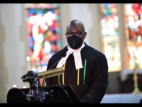 Chief Justice Bryan Sykes addresses congregants at St Andrew Parish Church during Sunday’s Assize service to mark the opening session of the Michaelmas term of the Home Circuit Court.