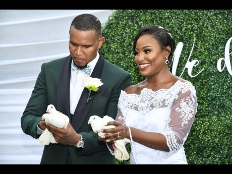 The couple release doves to commemorate their union and for loved ones.