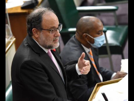 Opposition Leader Mark Golding addresses lawmakers as Parliament reviewed amendments to the Emergency Powers Act on Tuesday.