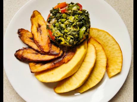 This Jamaican breakfast consists of steamed callaloo, fried roast breadfruit and fried plantains. 
