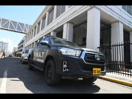 SWAT police personnel were among the heavy security presence at the Home Circuit Court where 33 alleged members of the Clansman-One Don Gang were being tried on Wednesday.